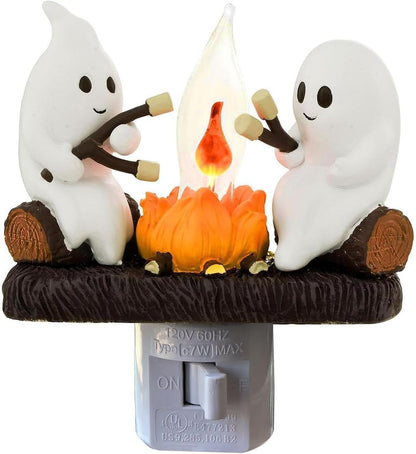 3d hand-molded resin figurine of two ghosts roasting marshmallows around a campfire