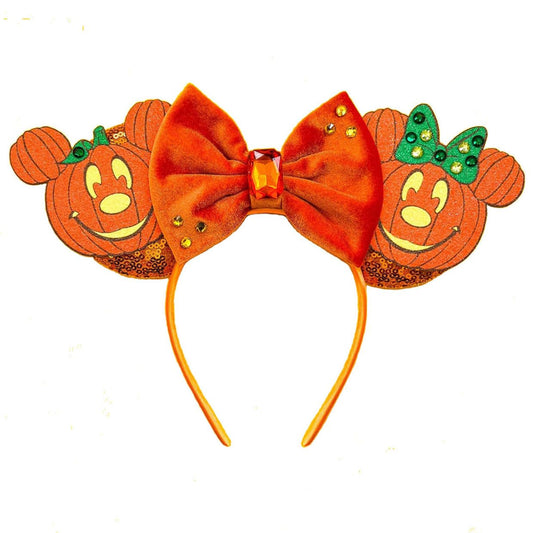 orange sequin-covered mouse ears with a three-dimensional feel